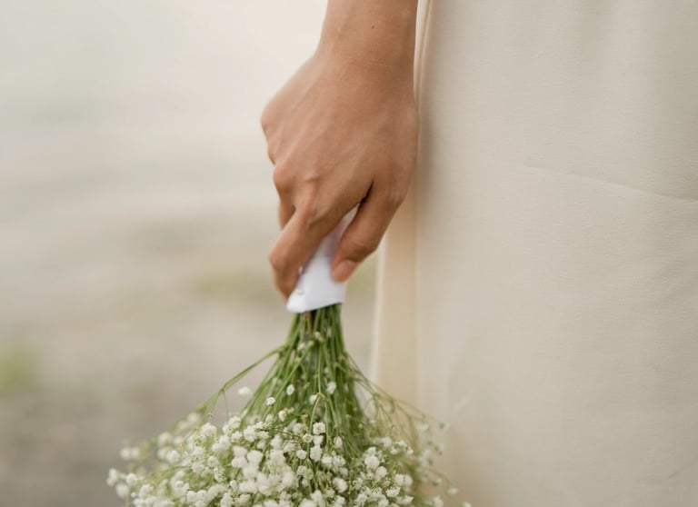 Bride holding bouquet detail during bridal portrait session at Melasti Beach Bali