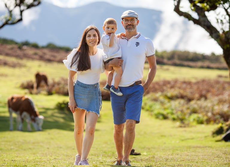 Family walking together through misty ancient forest during afternoon photography session at Fanal
