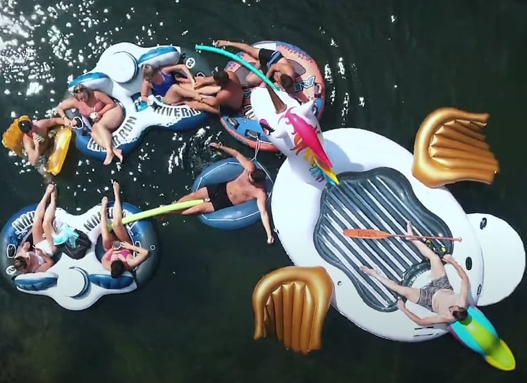 a group of people are floating in the water