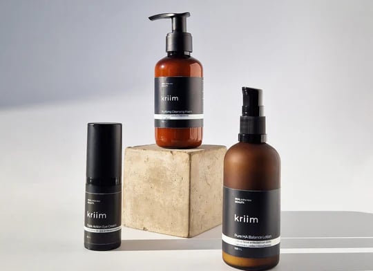 a variety of skin care products including a bottle of skin care products