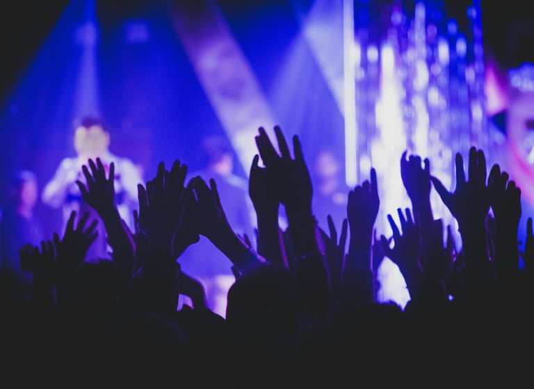 a person holding their hands up in the air