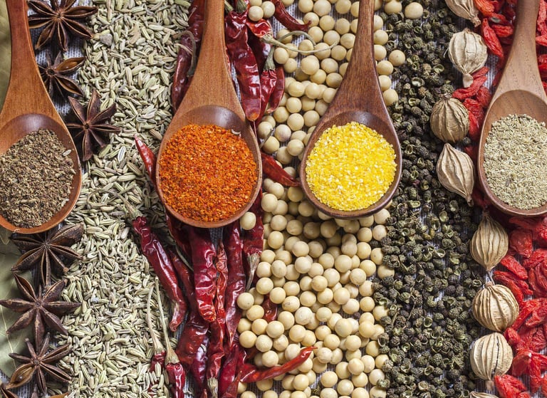 a variety of spices and spices are displayed on a table