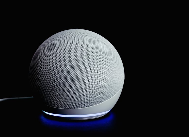 Futuristic white smart speaker with glowing lights in dark background