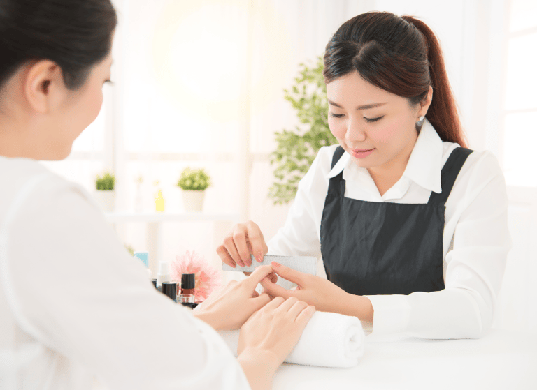nail technition providing nail services 