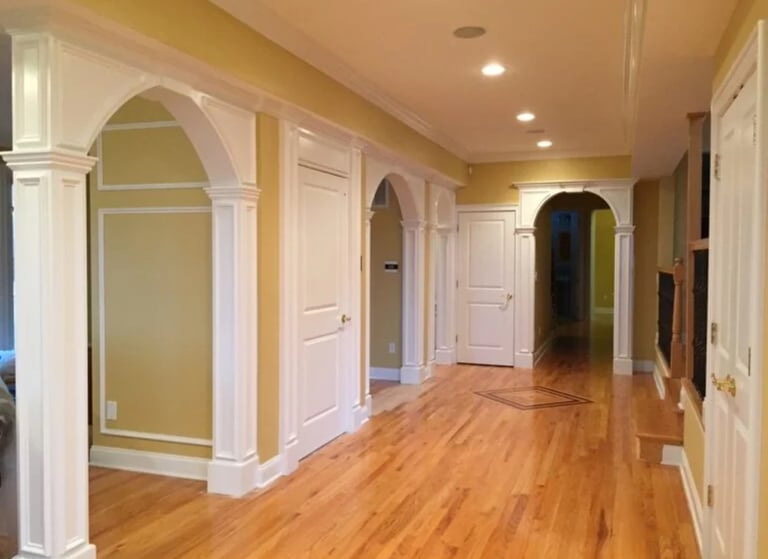 Custom arched openings and architectural columns in an NJ hallway