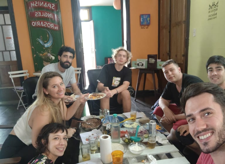 A group of people enjoying a meal together at a dining table