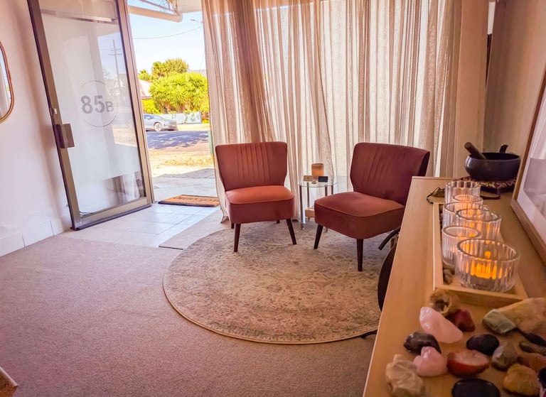 Comfortable, pink, velvet seating at the Sacral Space Clinic. 