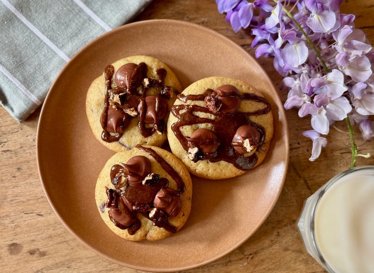 a plate with cookies and milk on a plate