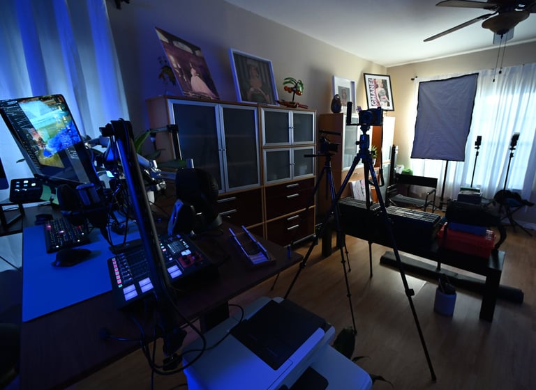 a camera and a video camera set up in a room. Photography studio