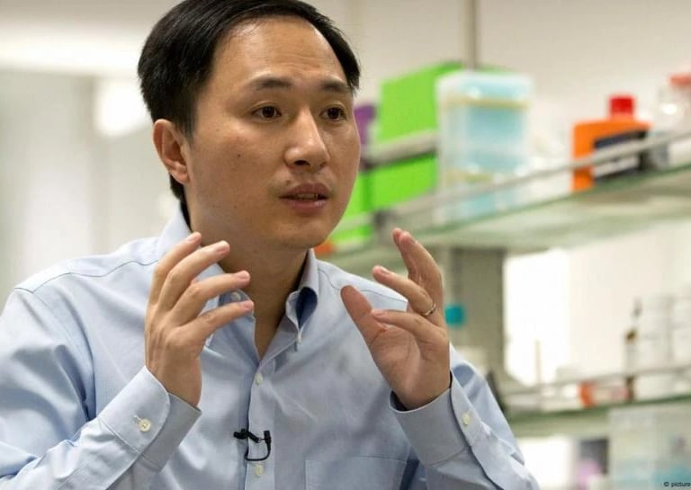 a man in a blue shirt and tie dye on his shirt