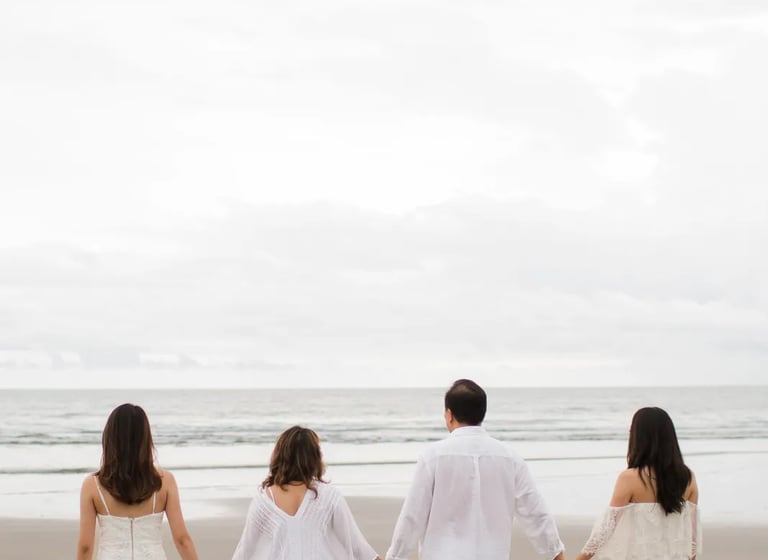 Janice family walking along the beach during a calm family photography session at Indigo Seminyak Bali
