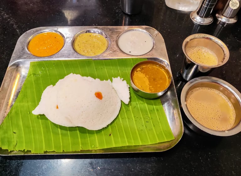 Traditional Tamil Nadu breakfast plate with idli, chutneys, and filter coffee