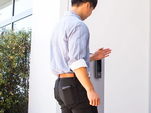 Person using a secure video intercom system to enter a business office in Las Vegas
