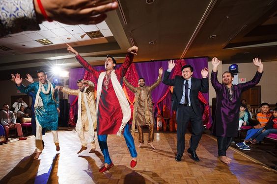 a group of people dancing and dancing on a dance floor