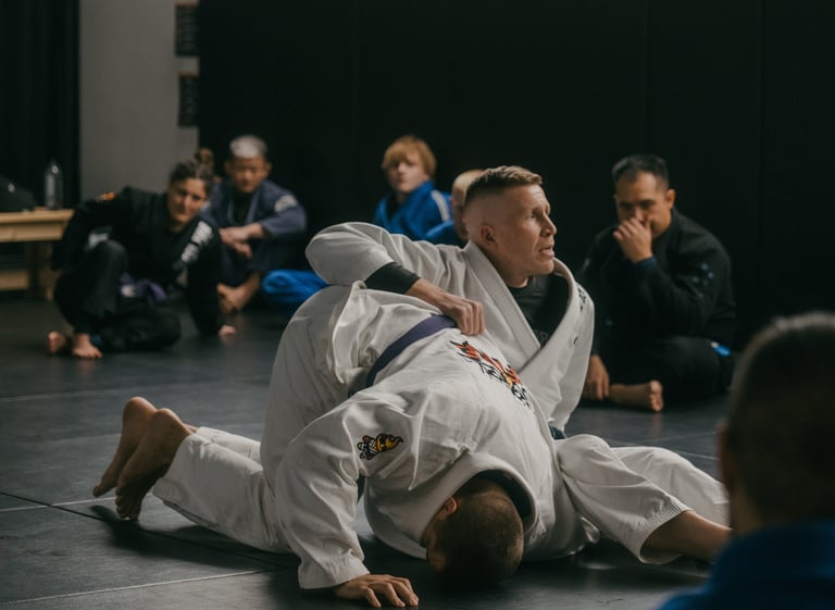 Jared demonstrating an omoplata during adult BJJ class
