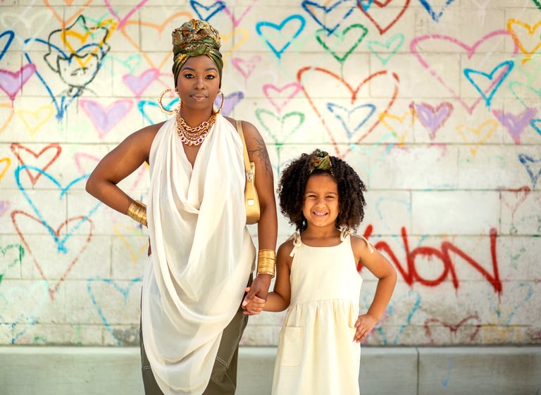 Mother and daughter during family photo session in Washington DC both wearing matching white