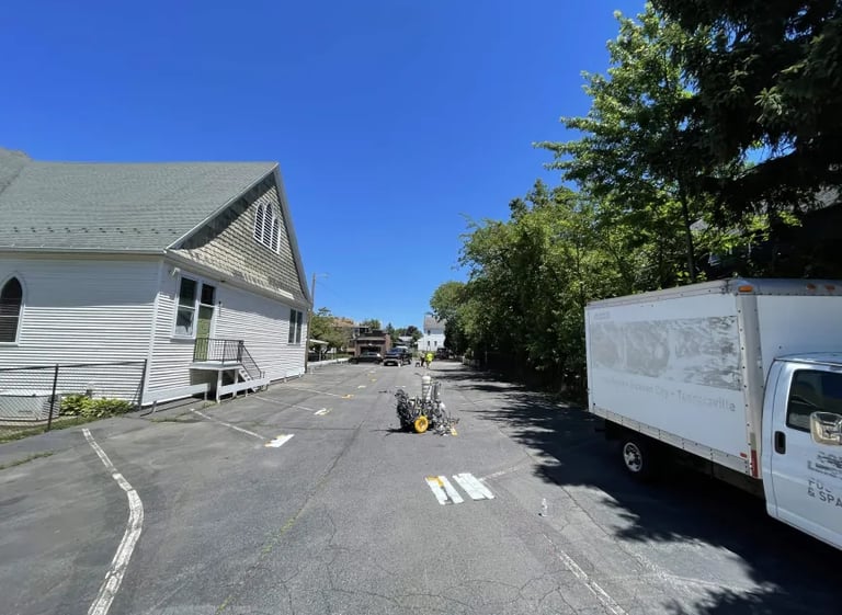 Before and after parking lot restriping showing faded to fresh lines