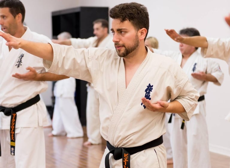 a man in a karate uniform is doing karate moves