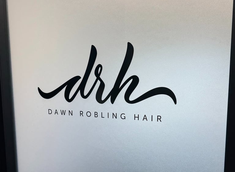 Frosted glass door with custom black Dawn Robling Hair logo decal installed by Big Sticker