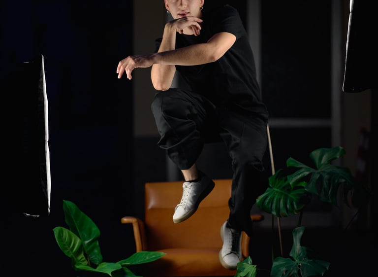 a man in black shirt jumping in the air