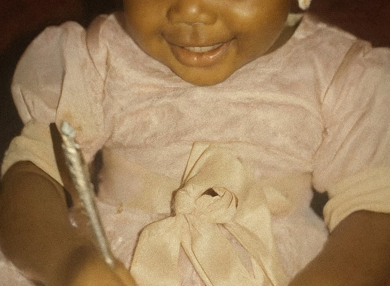 Iheoma Uzomba childhood photo with pen