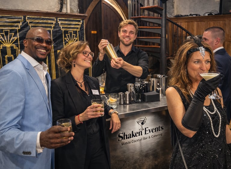 Guests enjoying cocktails part of a beverage package at a Gatsby-themed event