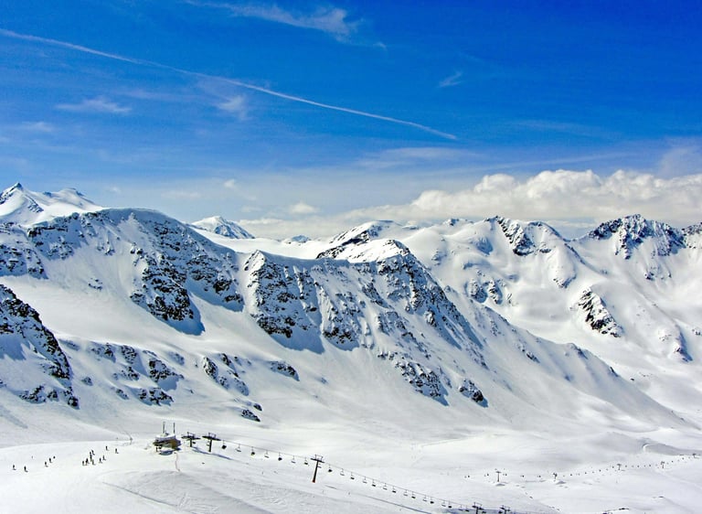 Panoramic ski terrain in the 3 Valleys Ski Area near Val Thorens, French Alps, with snowy peaks and connected slopes.