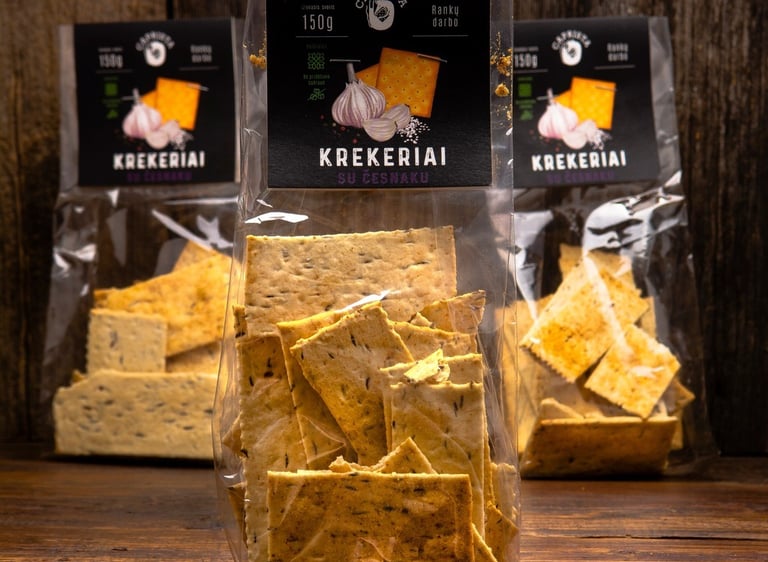 three  bags of crackers  on a table