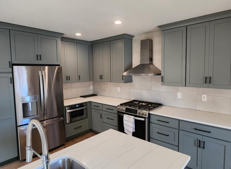 a kitchen with a stove top oven and a refrigerator