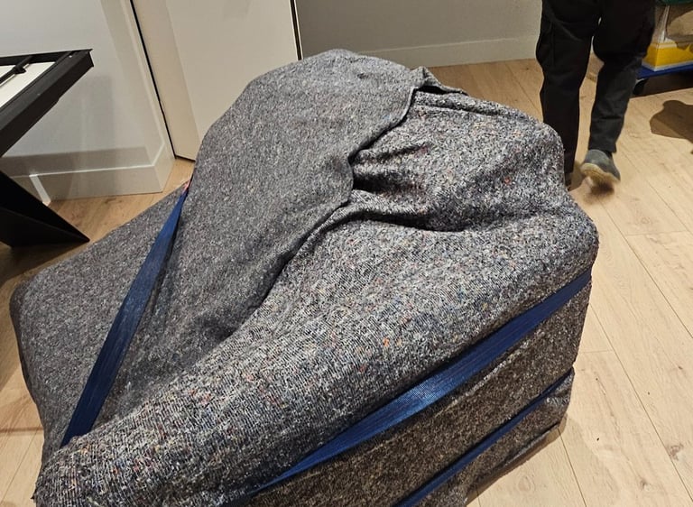 a man walking through a room with a suitcase