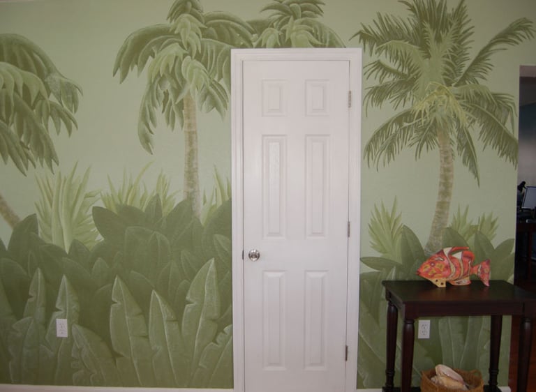 A playful Florida scrub palms and palms interior wall mural in a mutlitude of greens painted by Kathy LaFollett.