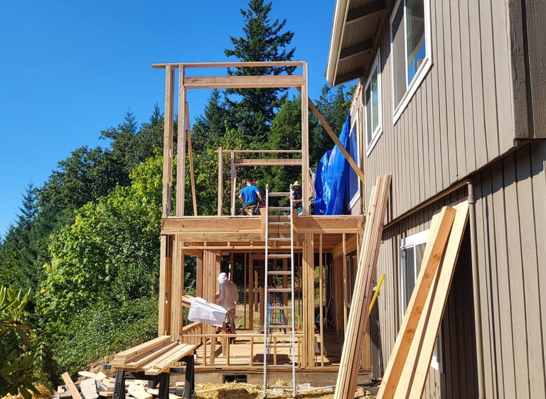 2-story addition on a house being framed.