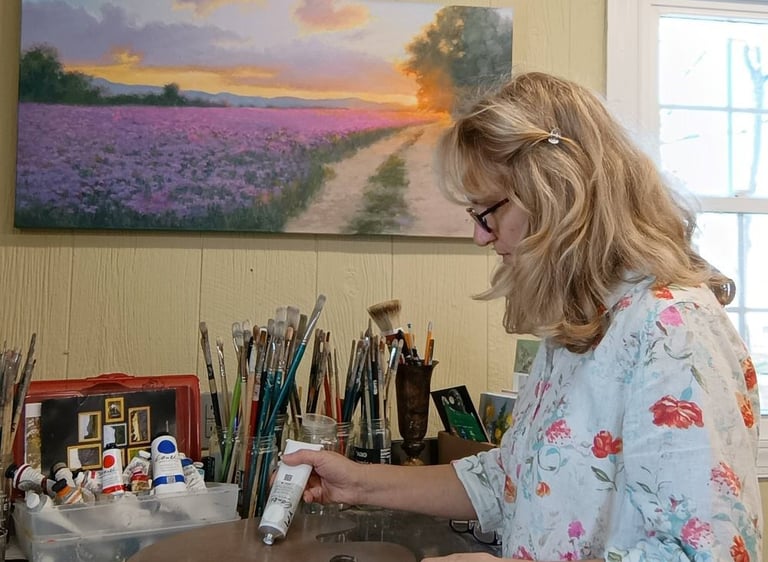 artist working in her studion on traditional, impressionistic oil painting