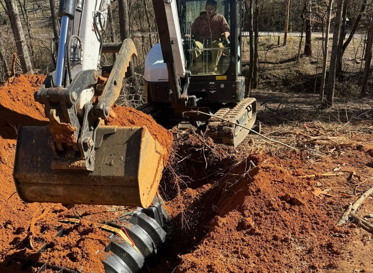 Bobcat E60 excavator backfilling a septic system in Lake-A-Wana TN