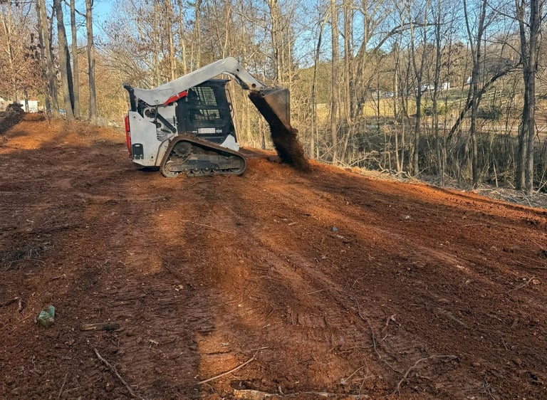 bobcat T66 skid steer dumping dirt