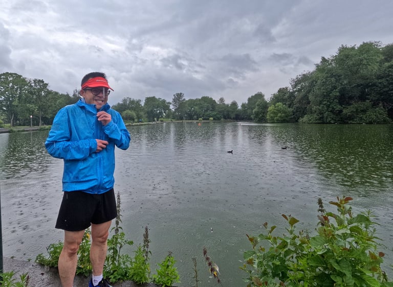 a man in a blue jacket and a red hat