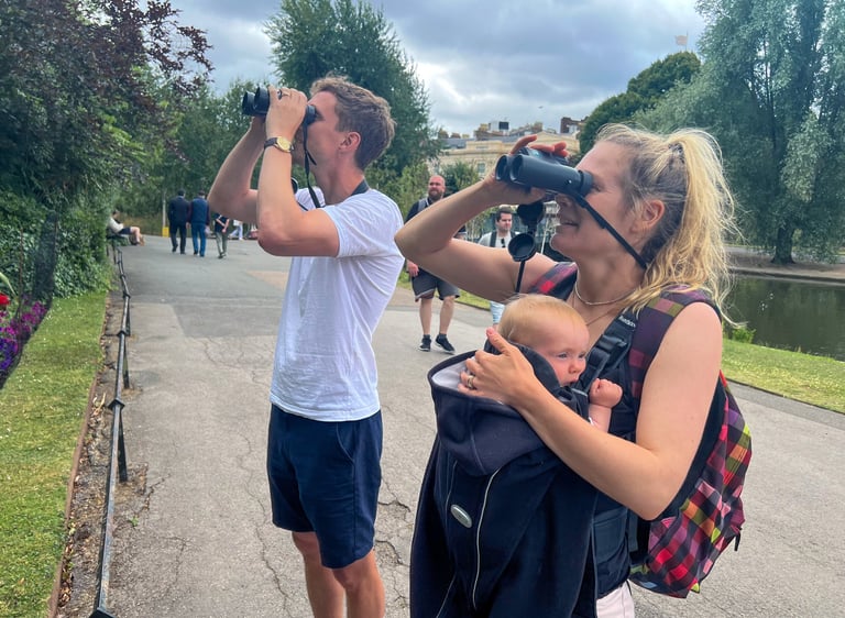 Husband, wife and baby daughter experiencing a Goldcrest - the smallest bird in the UK - at close quarters in Regent's Park.