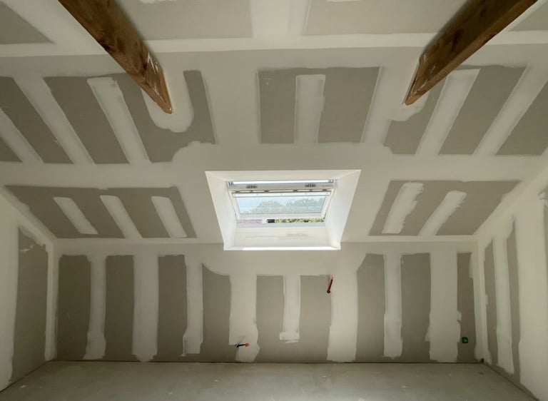 a room with a skylight and a skylight