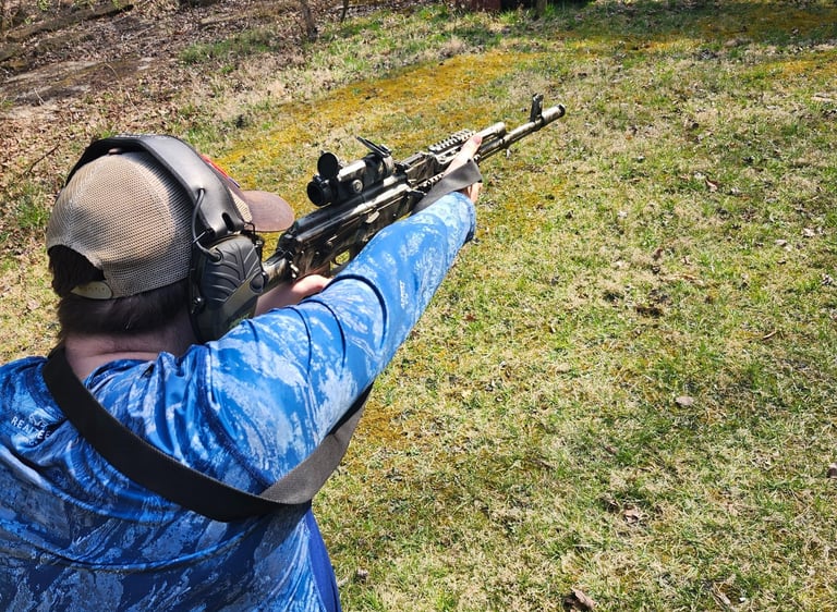 Man using self-defense firearm on range.