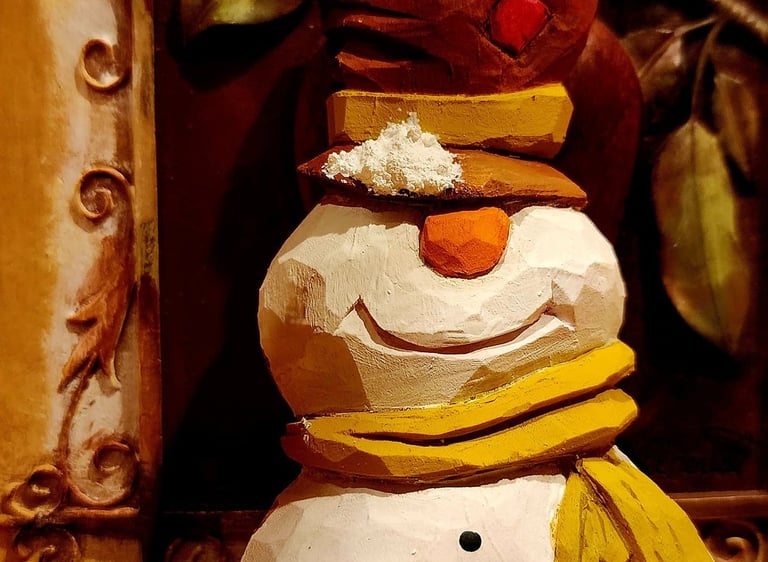 hand carved snowman with tophate and scarf, carved in basswood by James Smith