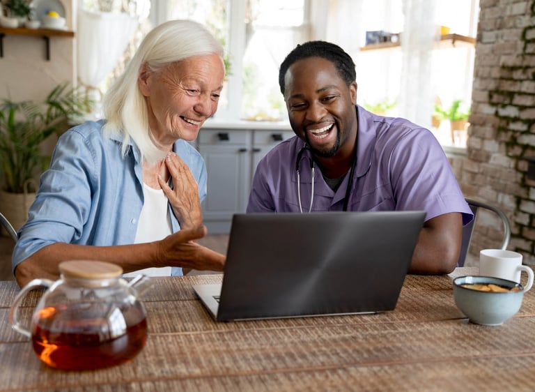 A compassionate male homecare provider offering attentive care and emotional support to an elderly