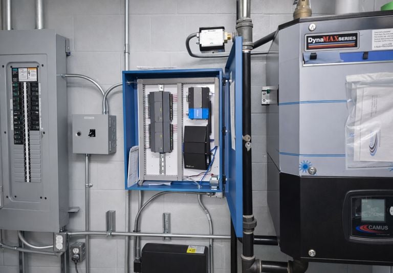 Building automation system panel installed next to a DynaMax boiler 