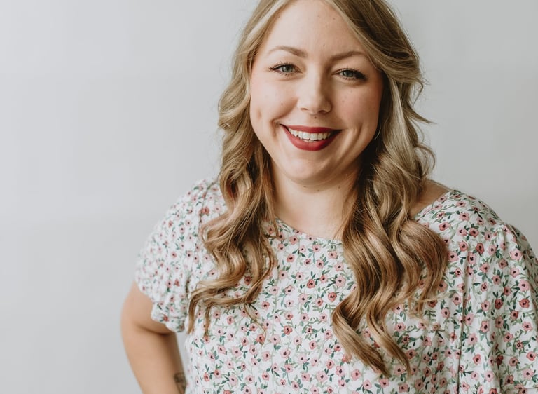 a woman smiling with blonde hair
