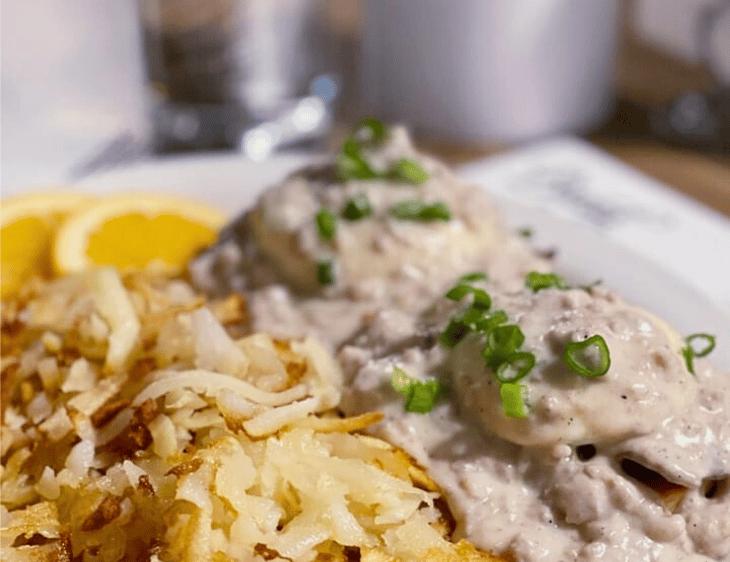 poached eggs on sourdough french bread sausage gravy