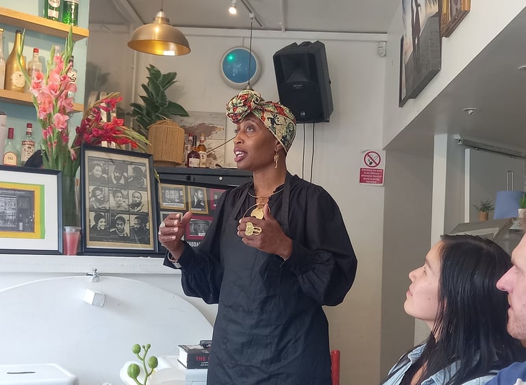 Jamila giving talk about Mangrove Nine