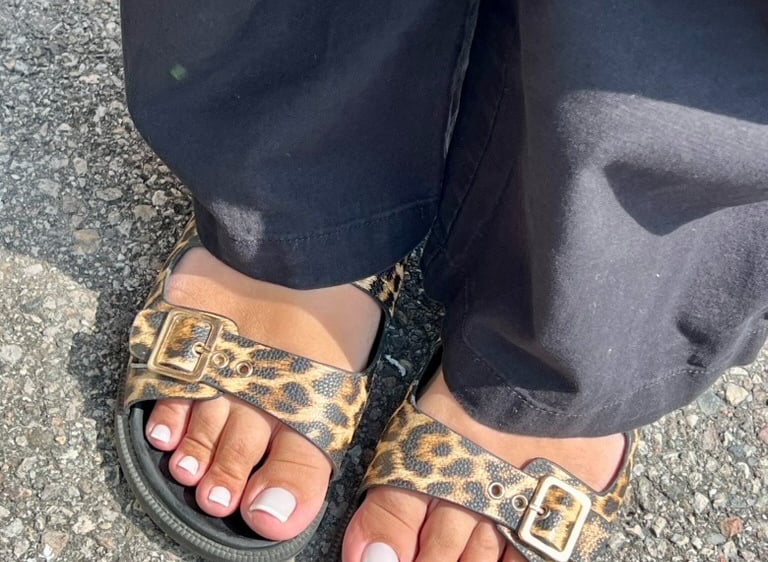 a person wearing a leopard print sandals and a leopard print sandals