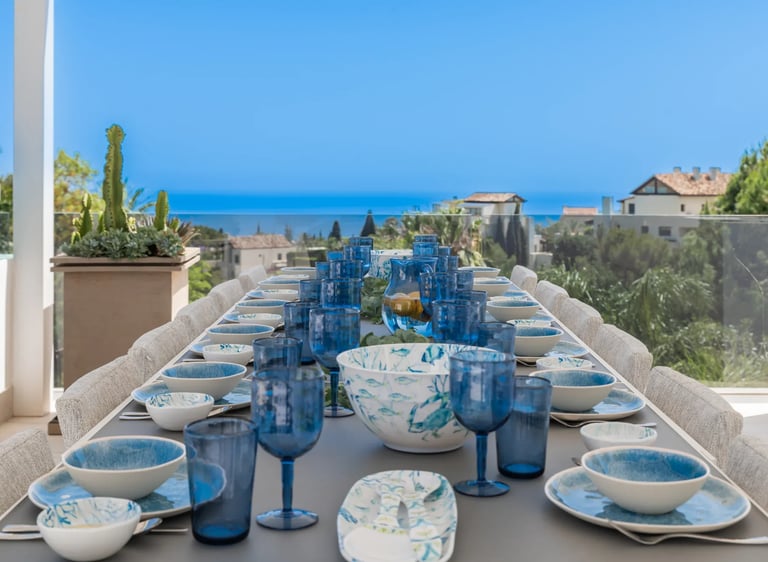 Rooftop dining terrace with ocean backdrop at Villa Serenity