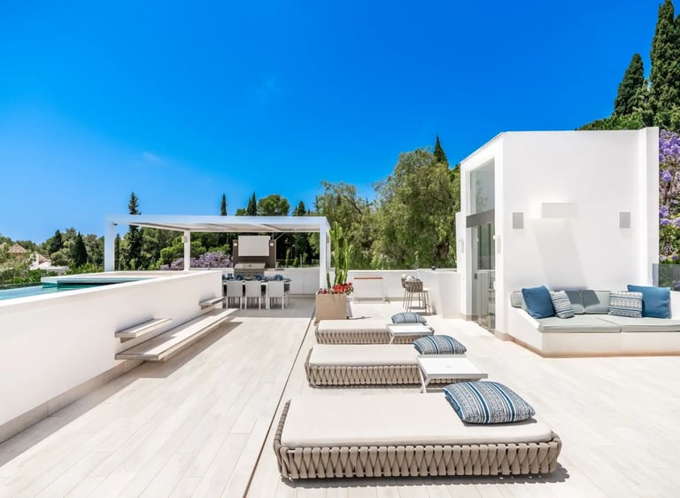 Villa Serenity rooftop with loungers and sweeping sea views