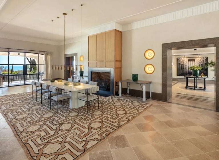 Lounge with patterned floor and dining area at Villa La Gratitud