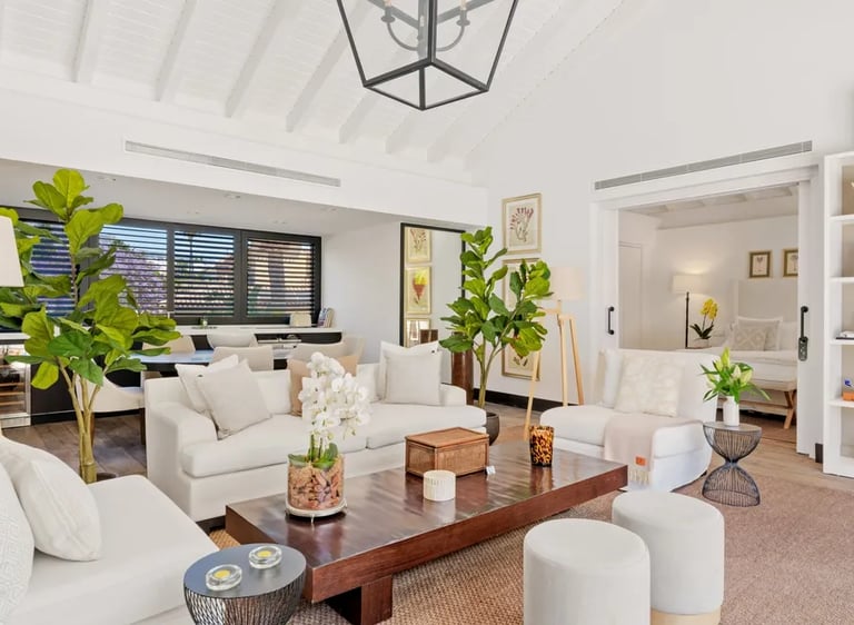 Bright open-plan living room with neutral décor and natural light at Villa El Olivo, Marbella